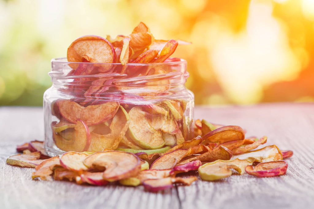 a jar full of dried apple chips