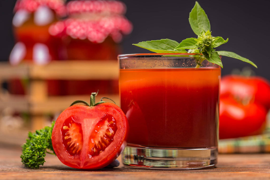 tomato and a glass of tomato juice