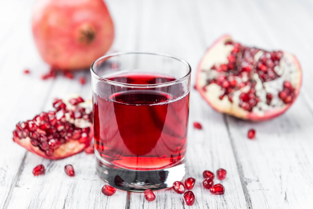 a glass of pomegranate juice