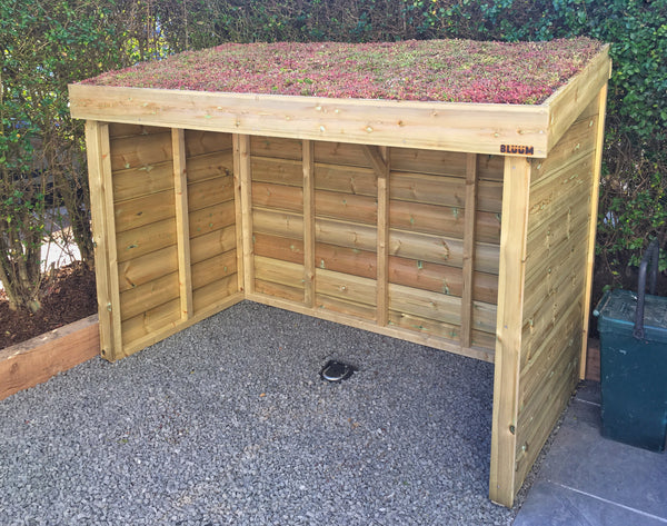 Hand made bike shelter with a secure ground anchor, living green roof planter for sedum and a dry place to keep bikes stored securely