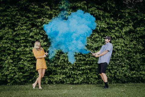 gender reveal for cute couple using blue powder discreet gender reveal cannons