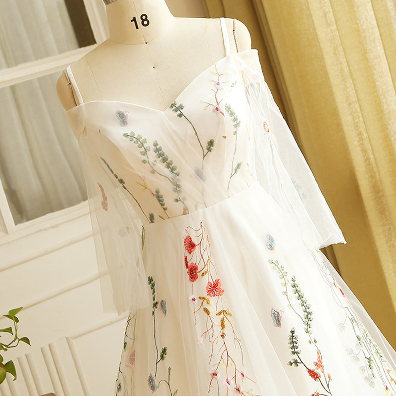 white dress with colorful embroidery