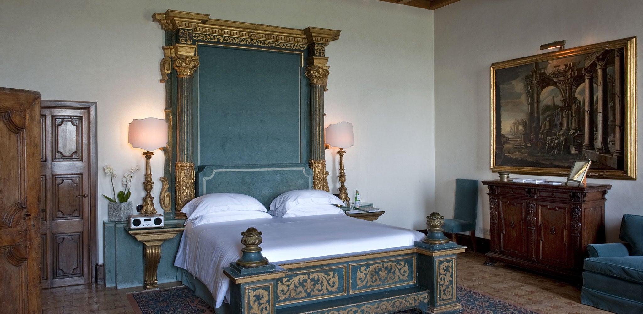 Sophisticated bedroom at one of the world’s most prestigious hotels, exemplifying the epitome of Renaissance decor in Italy