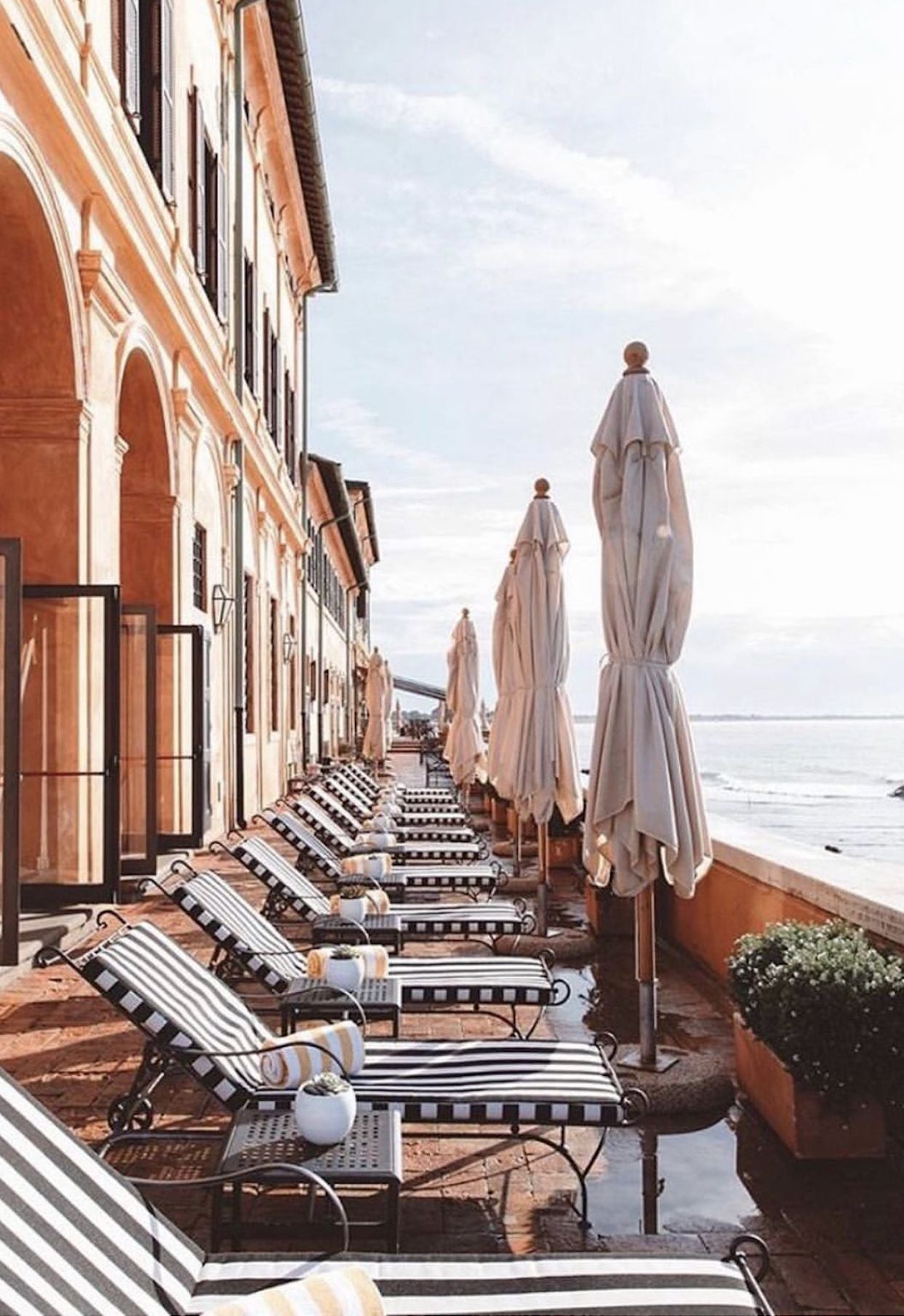 Sun beds in the outdoor setting of La Costa Vecchia Hotel, Ladispoli, in Rome