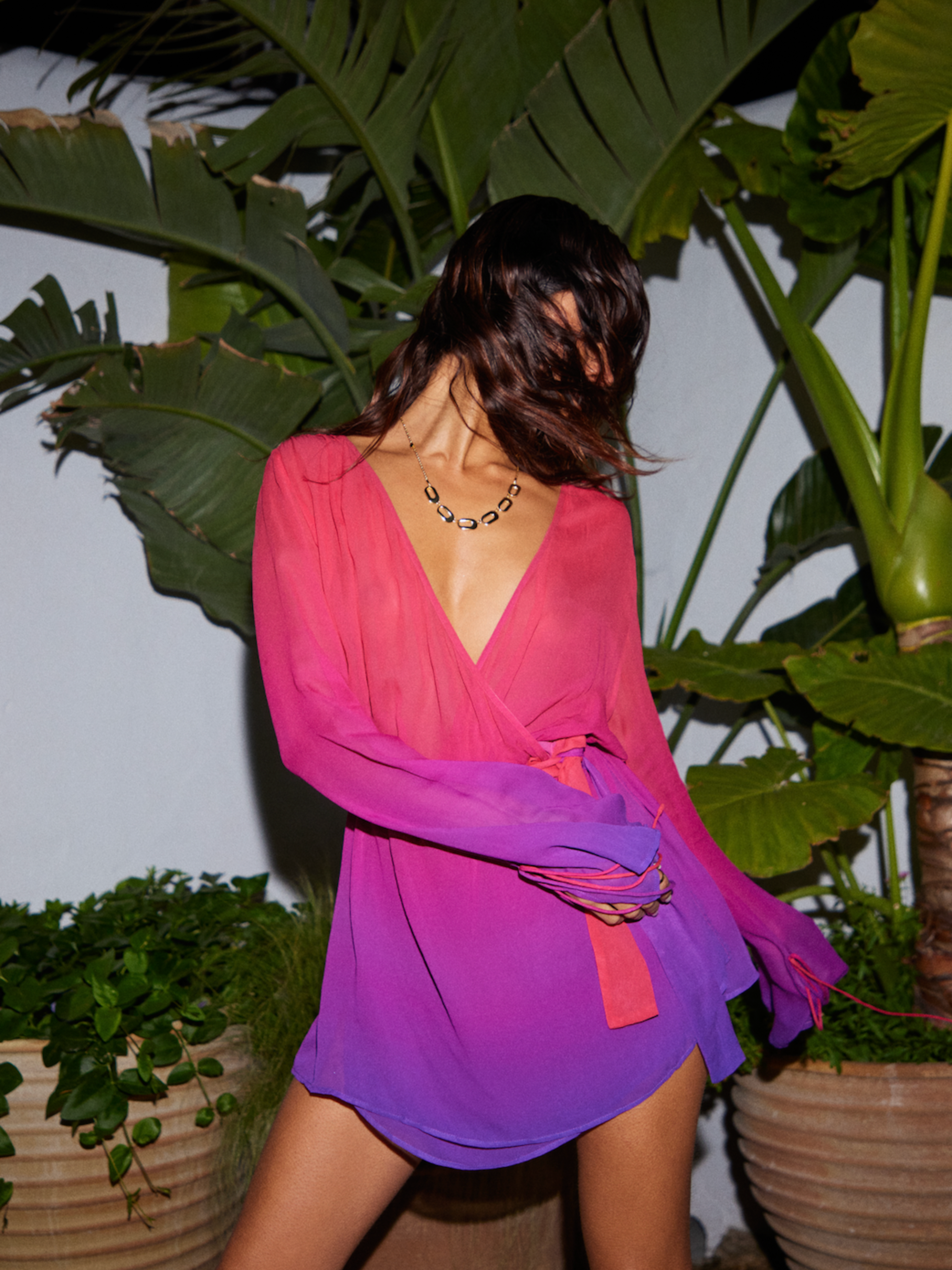 Exuding sophistication in the Palma Wrap Dress by Sommer Resort SS24, featuring a vibrant ombre print inspired by the colors of the Mediterranean sunset.