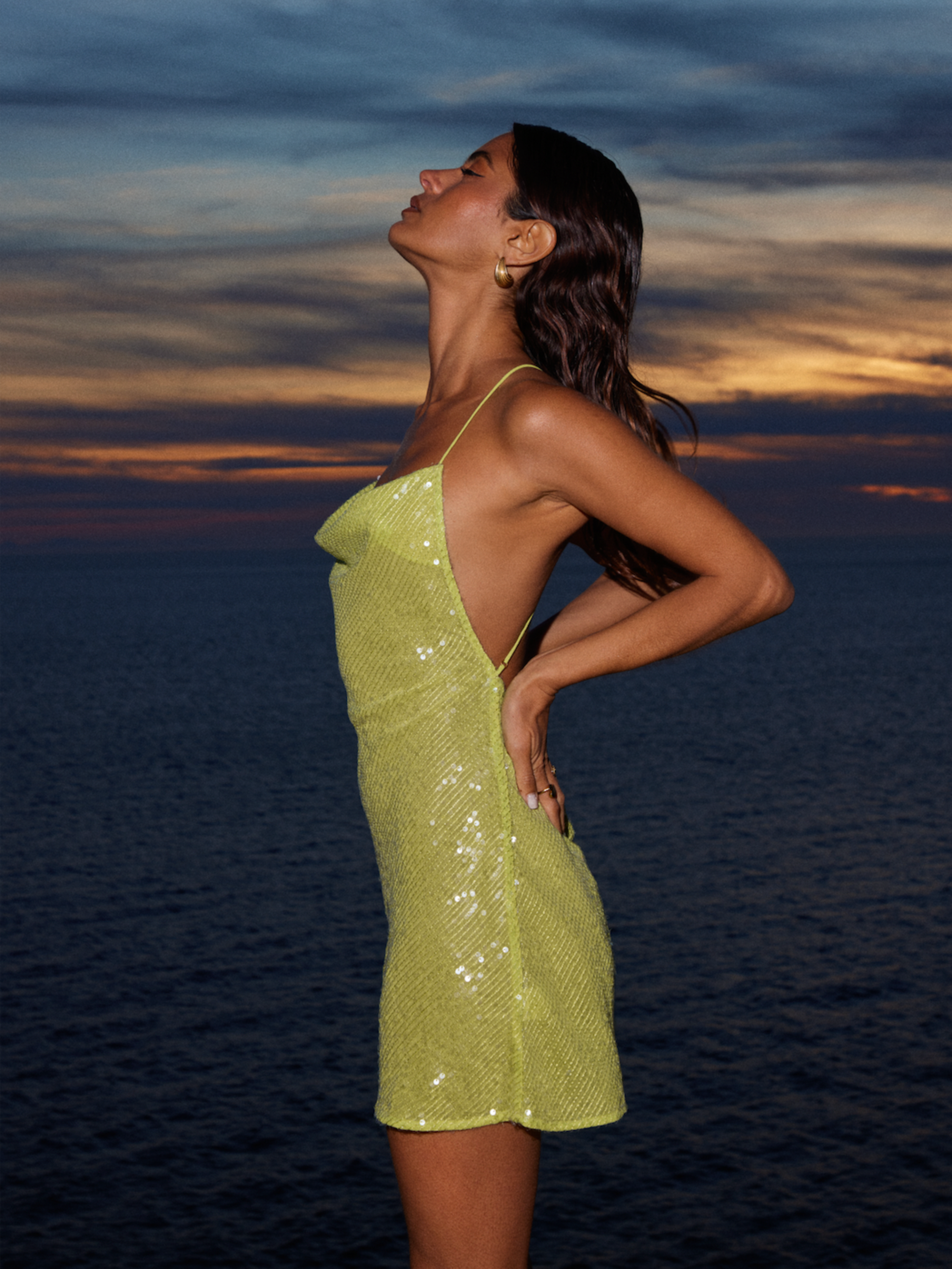 Admiring the sunset in a stunning resort wear