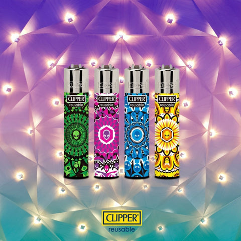 gradient blue, purple, and white psychedelic geometric background featuring four refillable, reflintable, reusable Clipper lighters. Each lighter has a different mandala pattern on it with an alien head at the center.  The Clipper lighters are shown four different colors: green, purple, blue, and yellow.