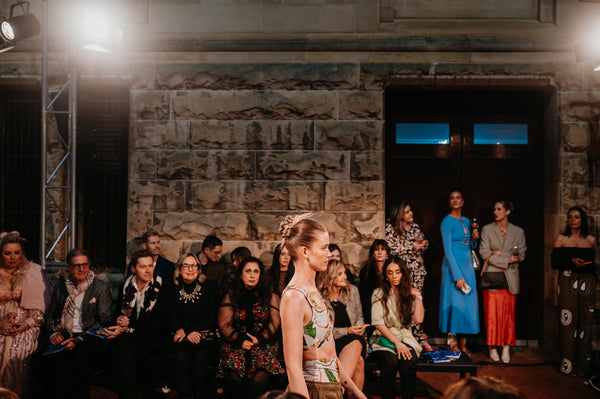 model walks down runway wearing hemp activewear