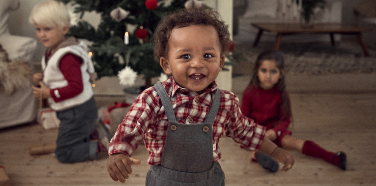 Baby boy celebrating his first Christmas