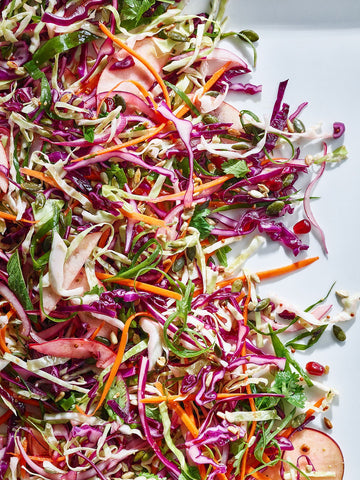 Cabbage, Apple, and Pomegranate Slaw with Cumin Dressing 