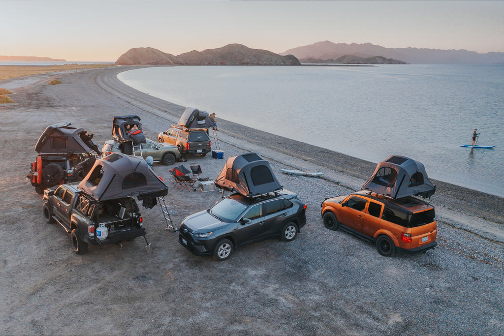 Caravan of six vehicles camping on the beach with iKamper roof top tents