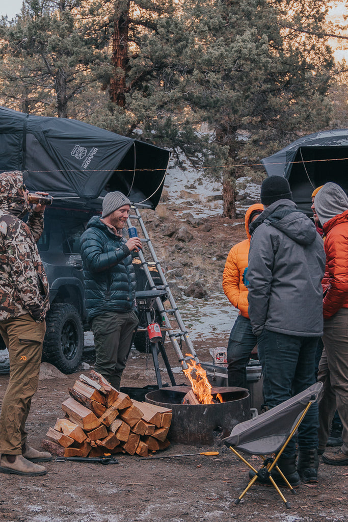 people hanging around the camp in winter