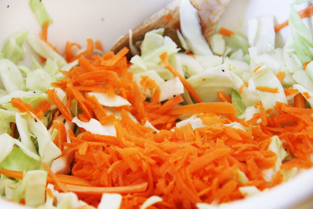 Mix carrots and cabbage into your coleslaw dressing