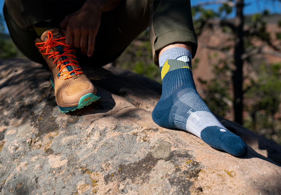 Hiker wearing Feetures trail socks
