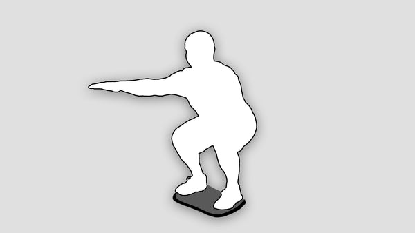 silhouette of man doing squat on stability board