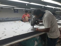 Blocks of fabric being cut
