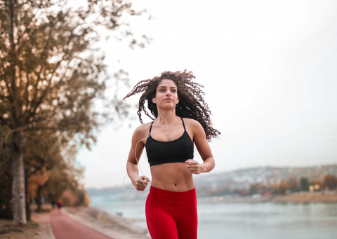 Woman on a run wearing a sports bra