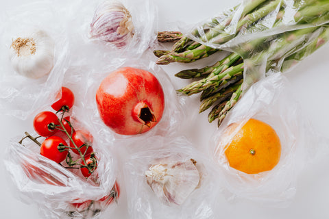 Plastic bags holding fruit