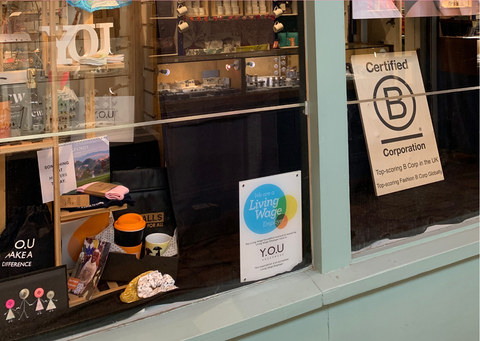 An image of the front of our Oxford shop with the living wage employer plaque 