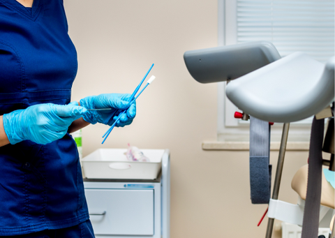 A nurse prepares to do a smear test