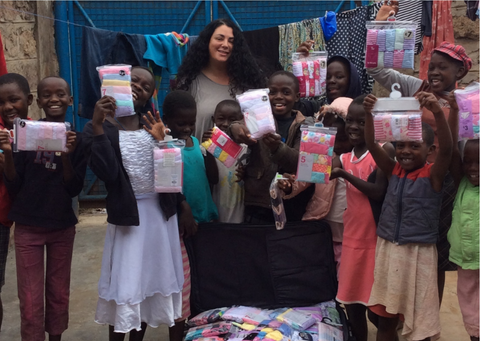 Maria, the CEO of Smalls For All, and several children who were given underwear