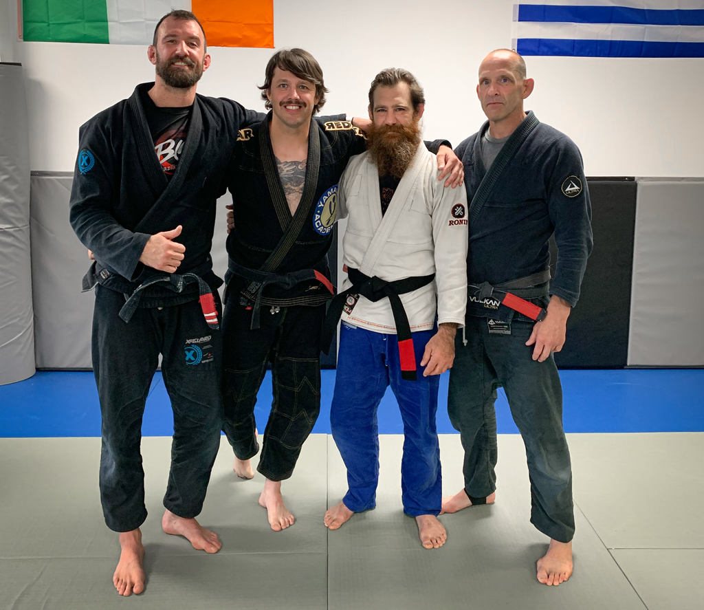 Savage Gentleman founder Josh Tyler MMA with his coaches after receiving BJJ Black Belt