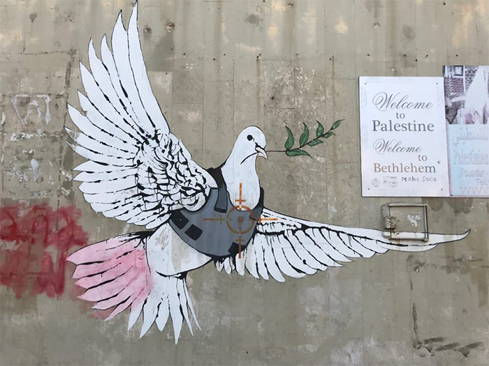 “Banksy in Bethlehem" graffiti