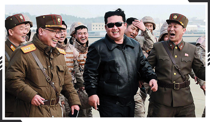Kim Jong Un laughing with officers