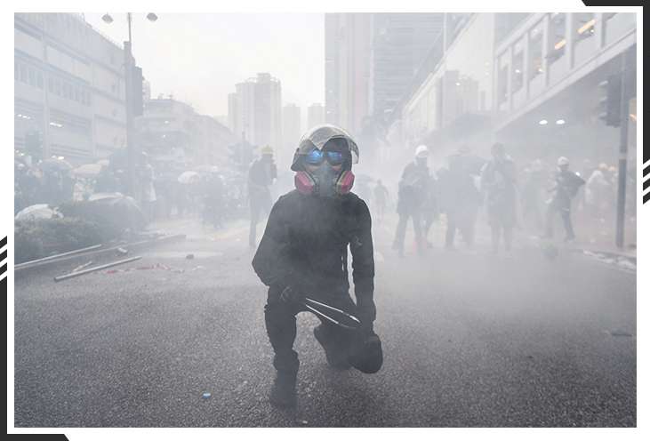 Gas mask clad man in street