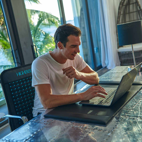 a man working in front of his laptop