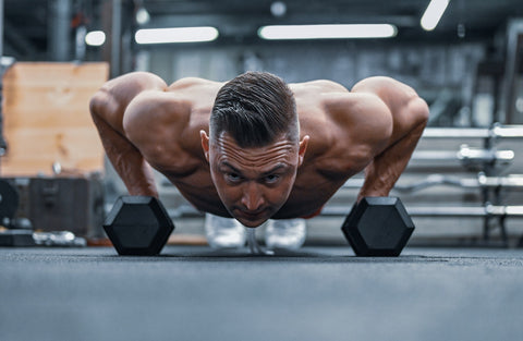 Man doing push-ups at a gym