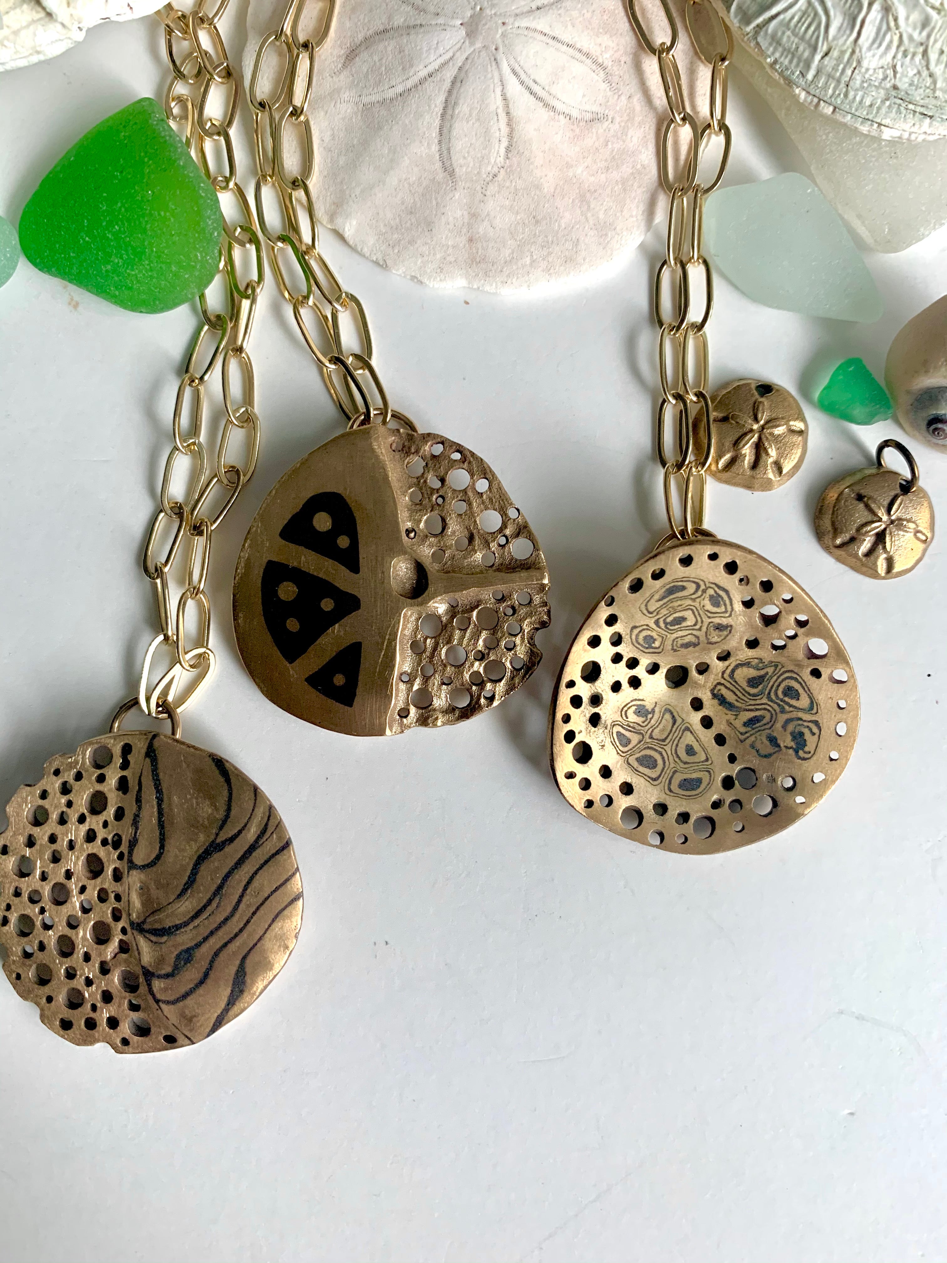 Sea shells with ocean inspired art jewelry necklaces