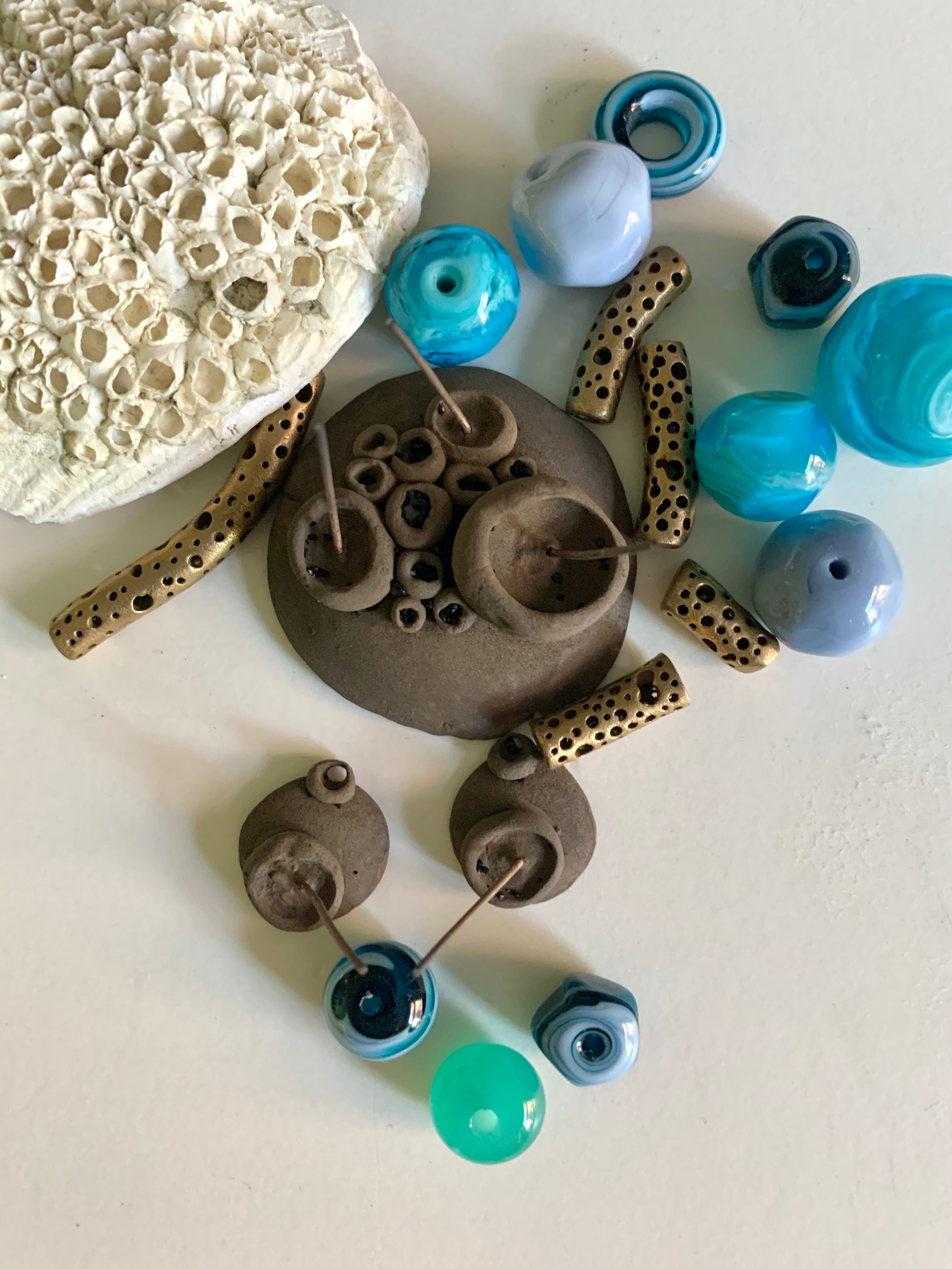 Artisan made ocean coloured glass beads with new bronze barnacle jewelry pieces