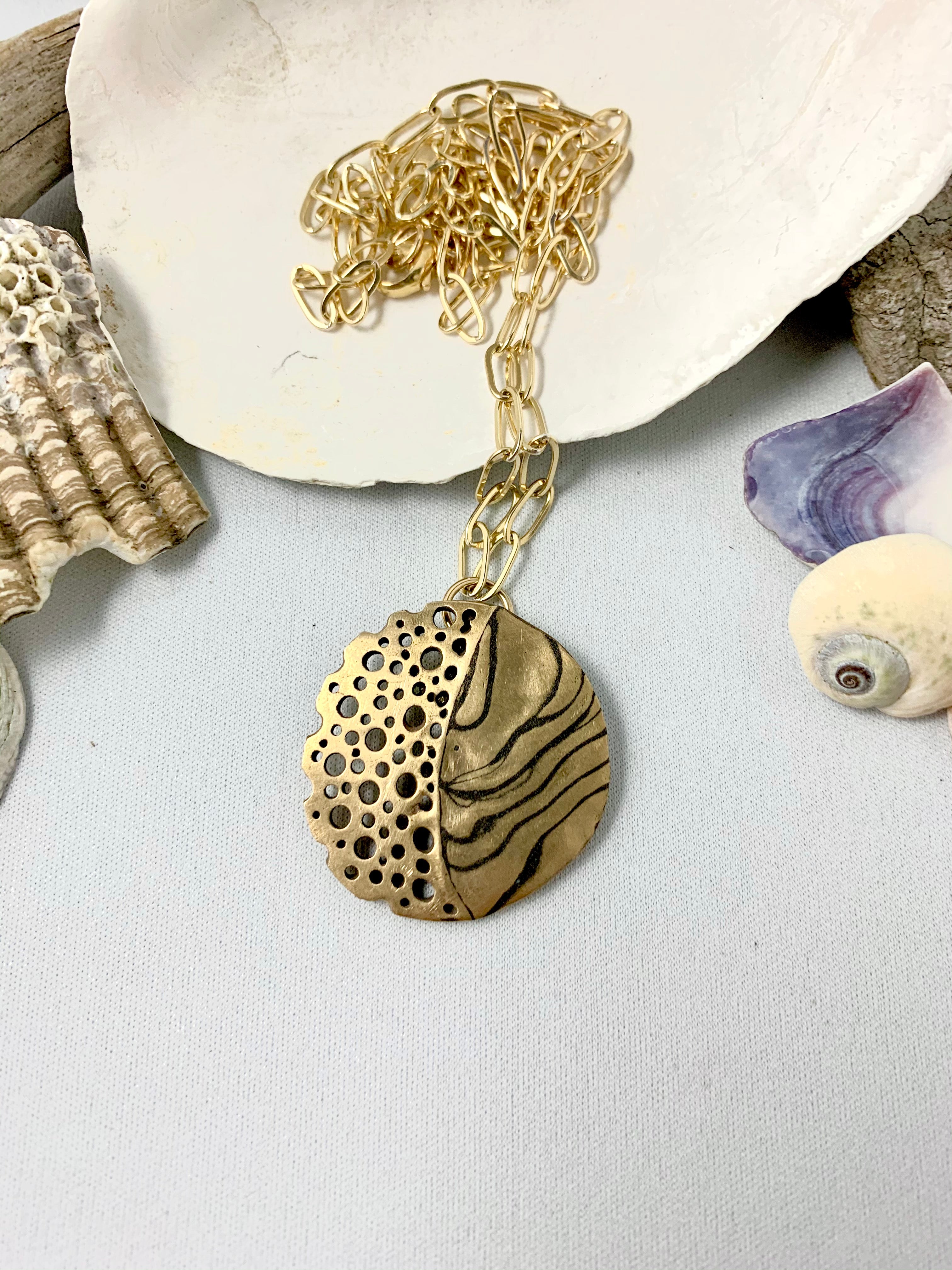 Unique patterned metal artisan made ocean inspired necklace