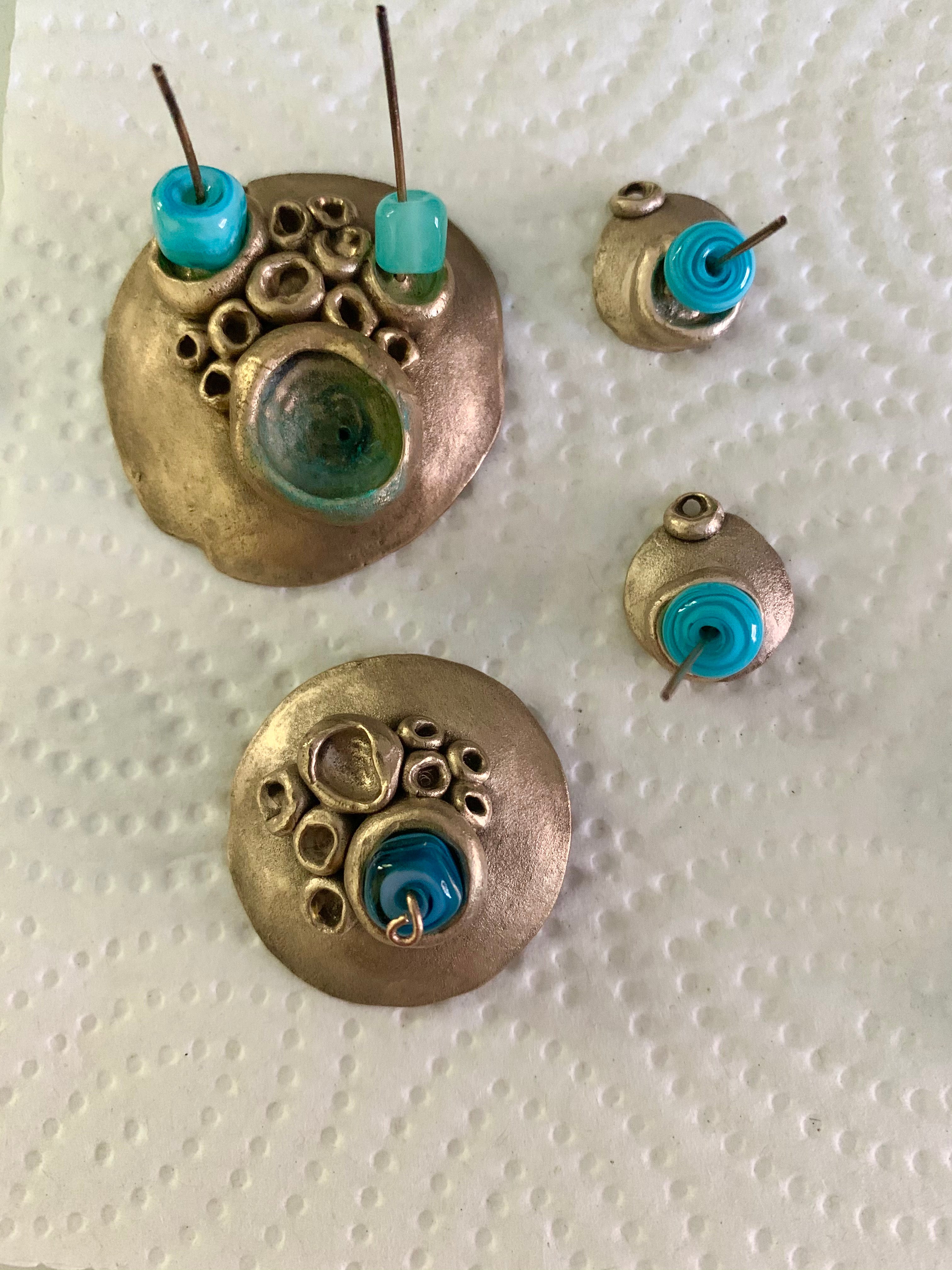 Blue handmade glass beads with barnacle bronze jewelry pieces