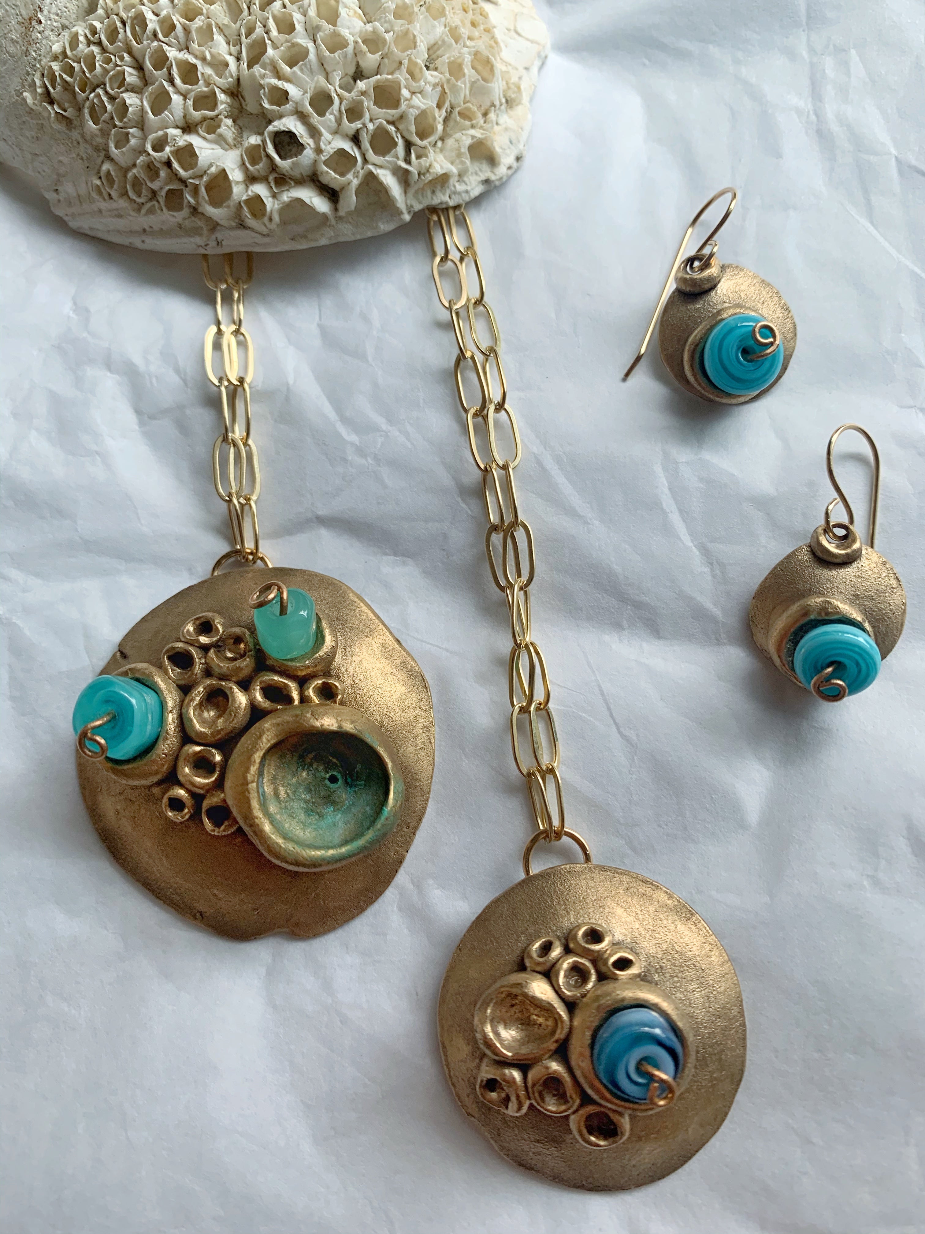 Artisan made bronze jewelry with blue glass beads