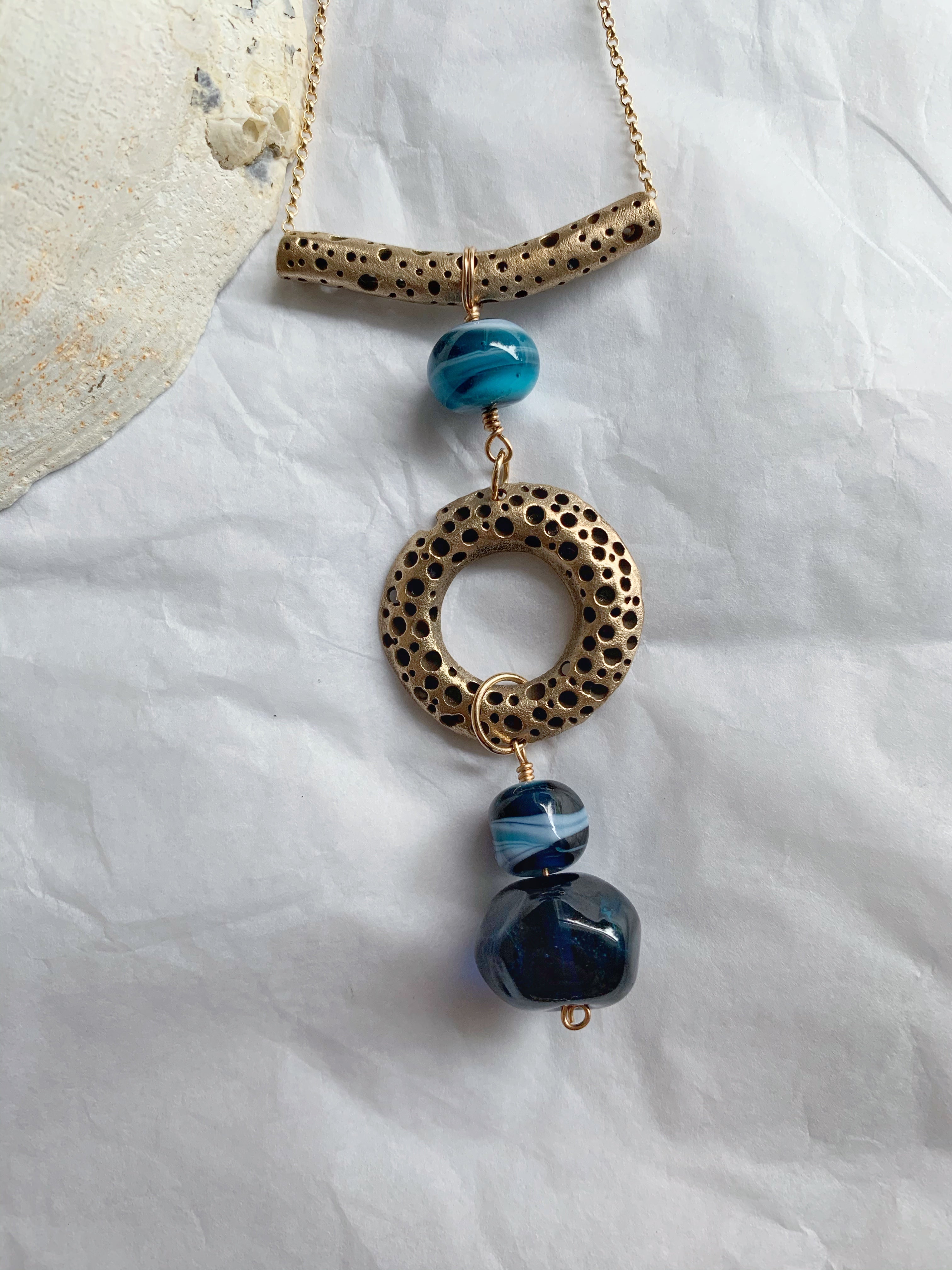 Artisan made bronze and blue glass bead statement necklace