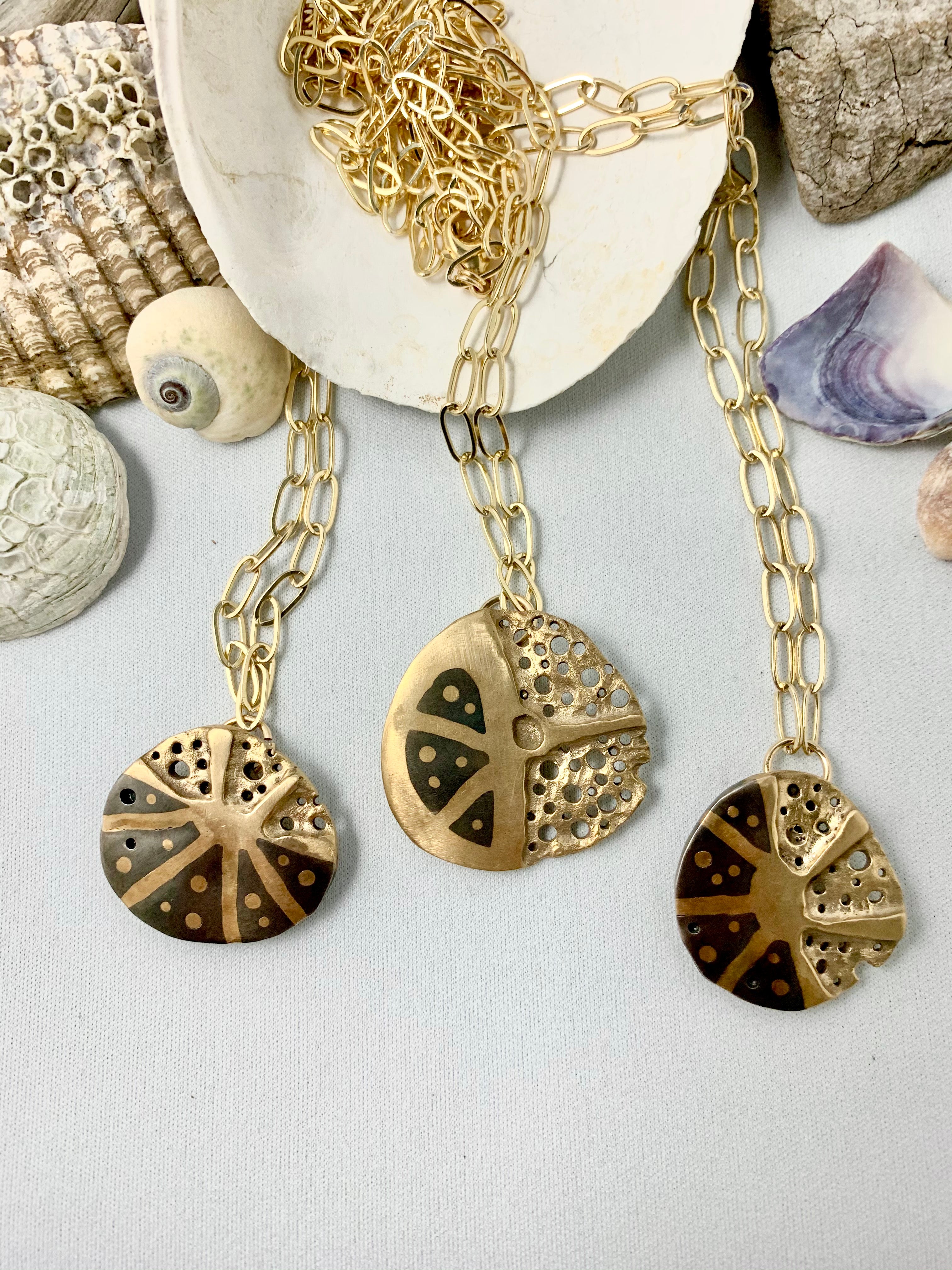 Seashells with coral inspired steel and bronze necklaces
