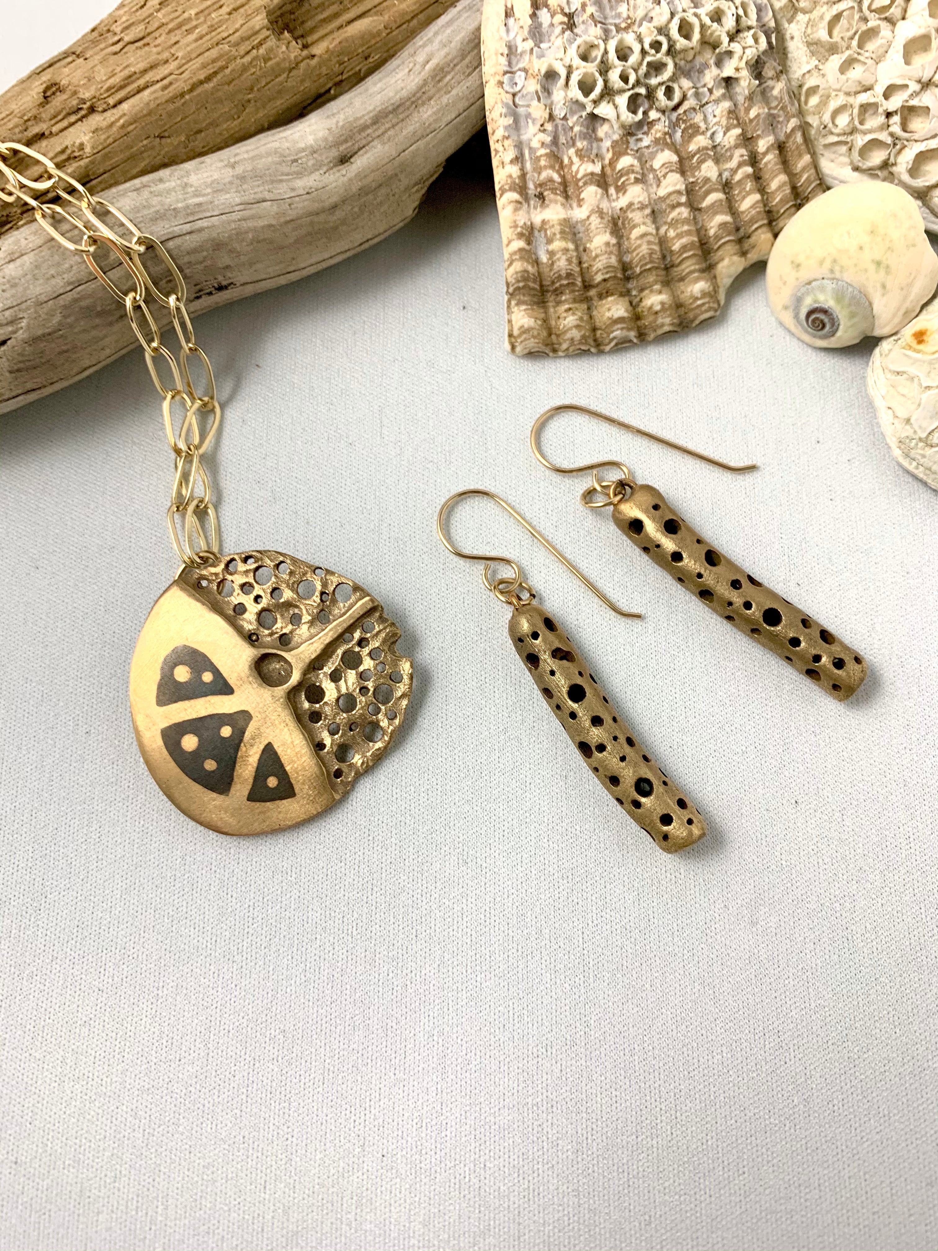 Artisan made bronze necklace paired with artisan made earrings