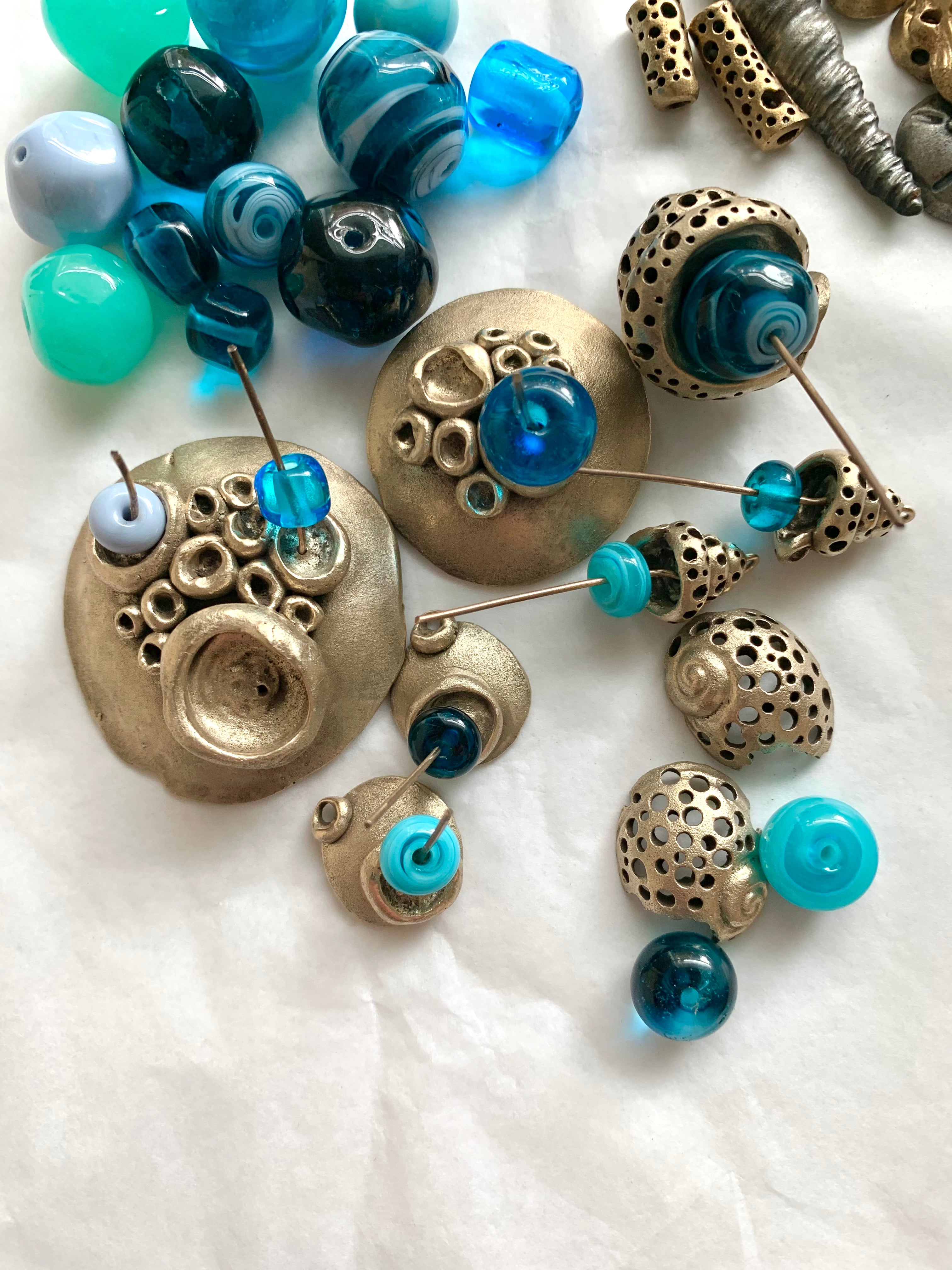 Bronze ocean inspired art jewelry with blue handmade glass beads