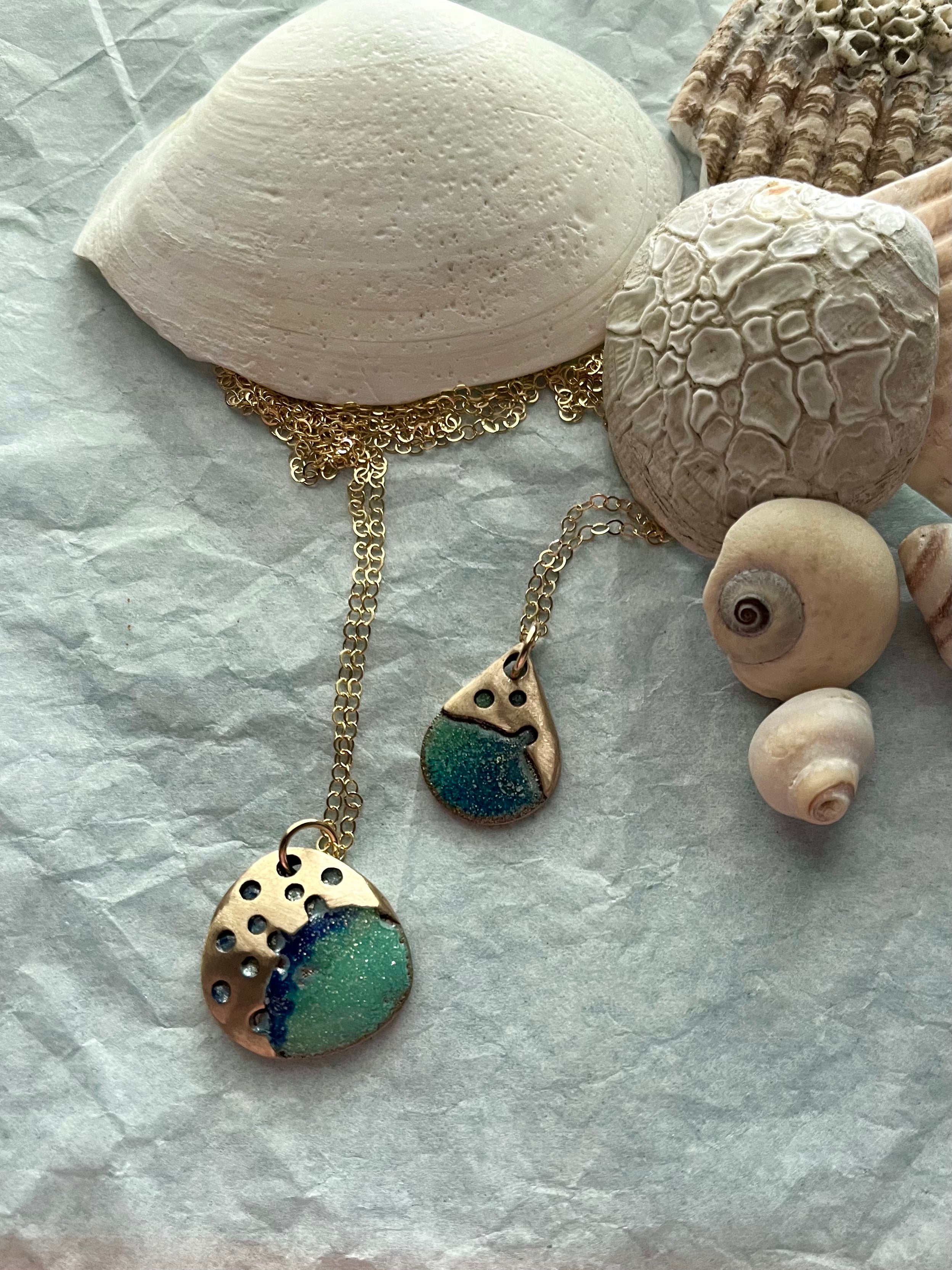 Two new bronze art jewelry necklaces with seashells