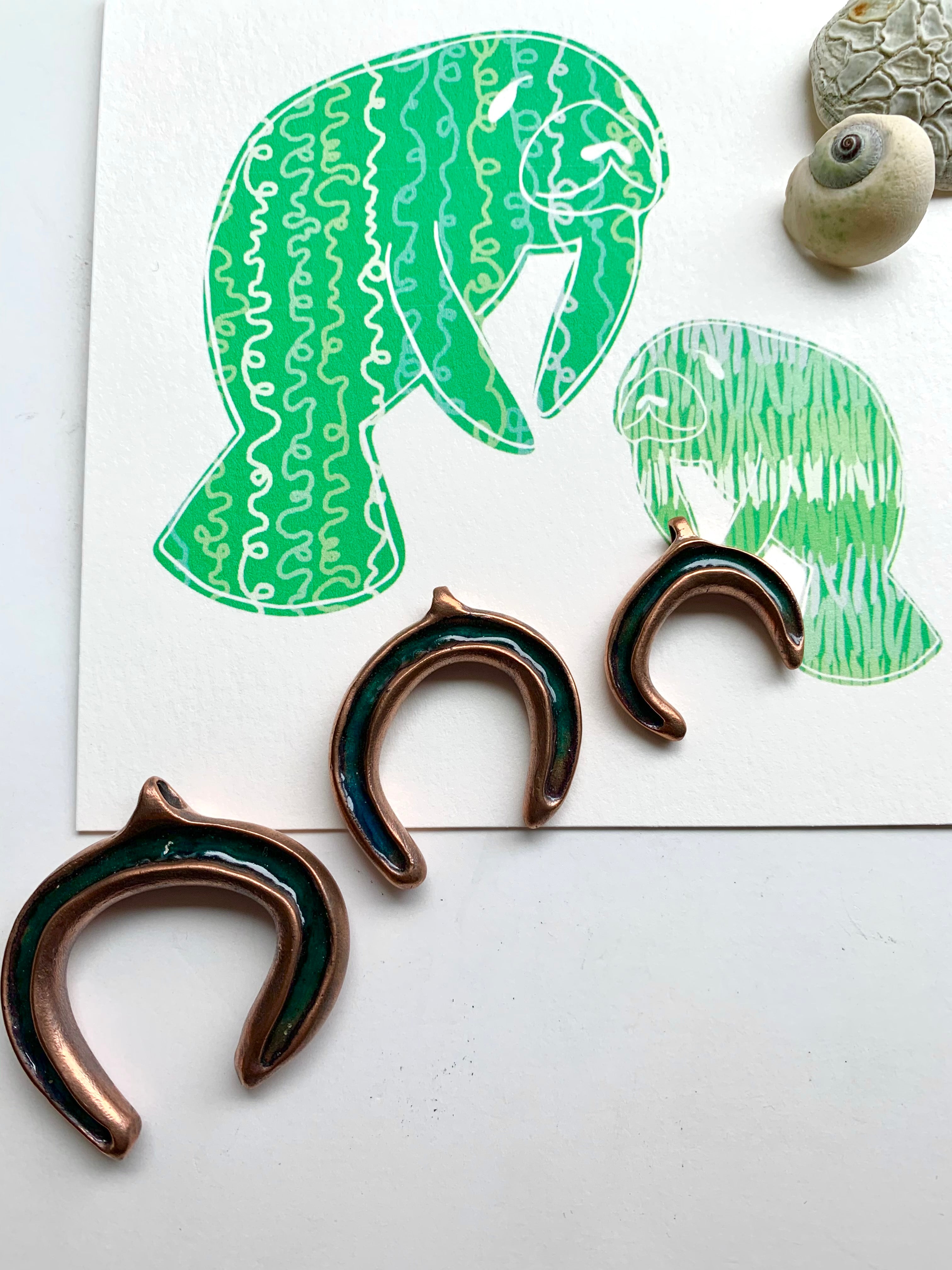 Manatees discover copper handmade necklaces