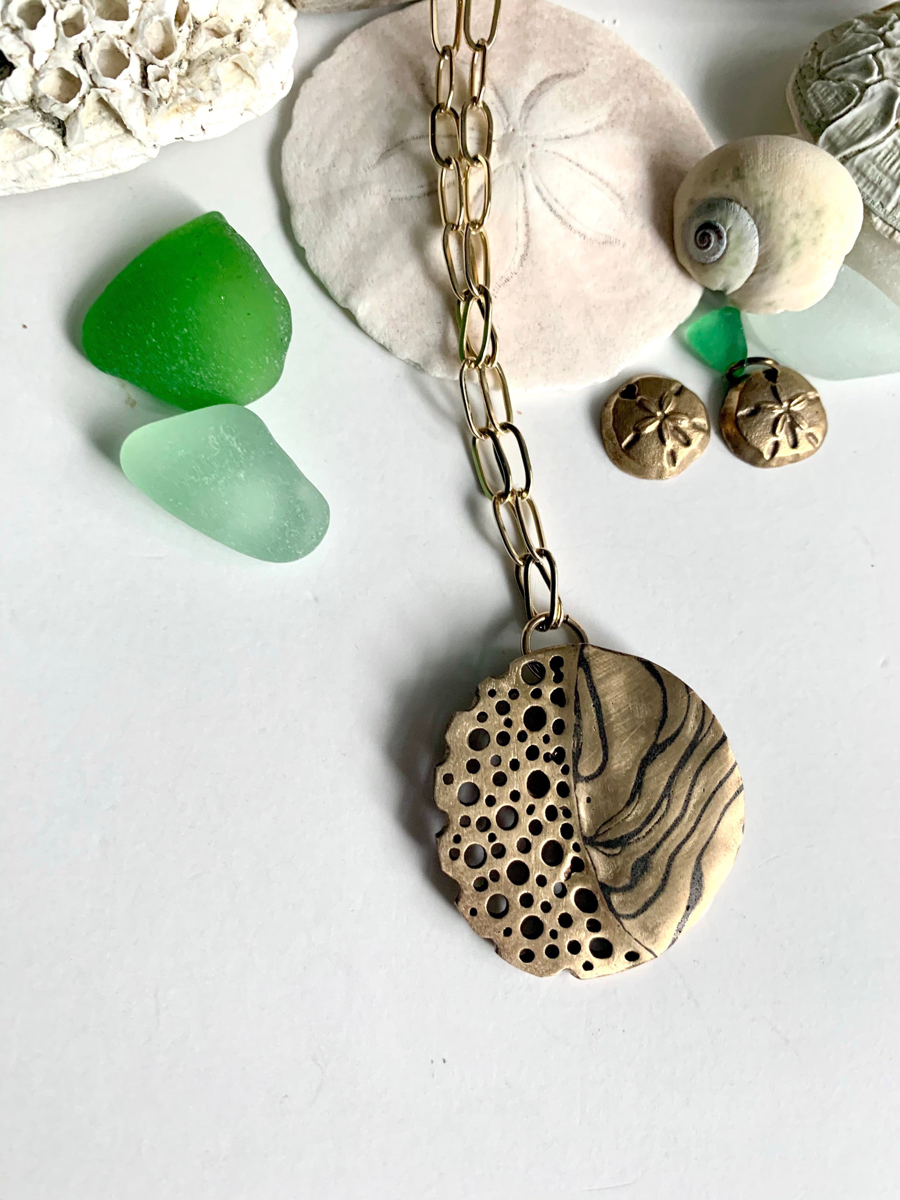 Ocean inspired hand crafted necklace with shells and green sea glass