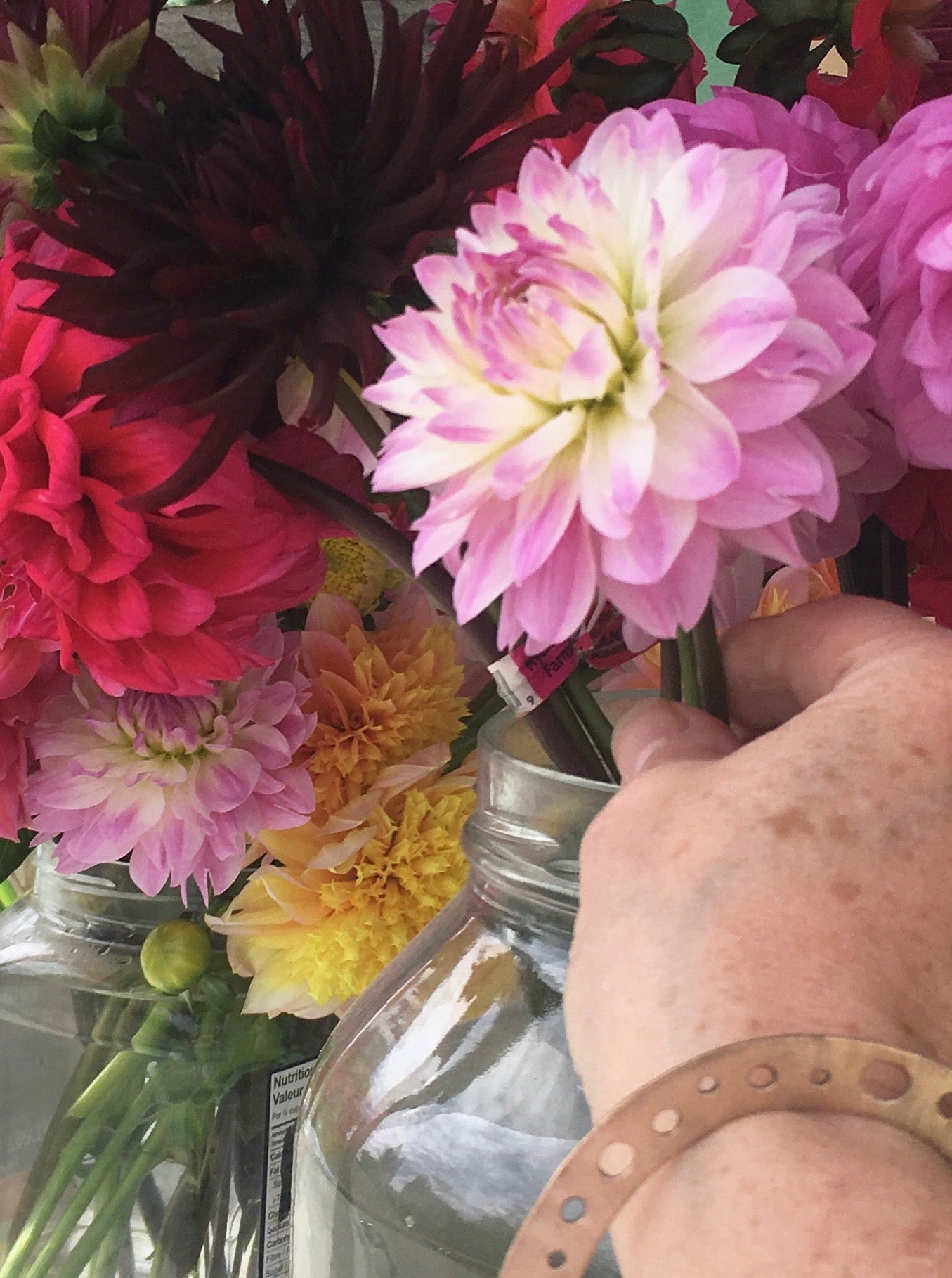 Artisan bronze bangle and pink dahlias