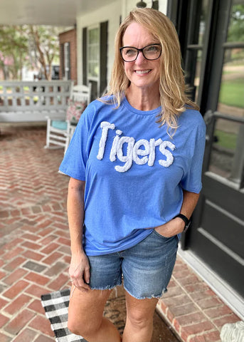 Kim wearing our Chenille Tigers Embroidered Tee standing on front porch.