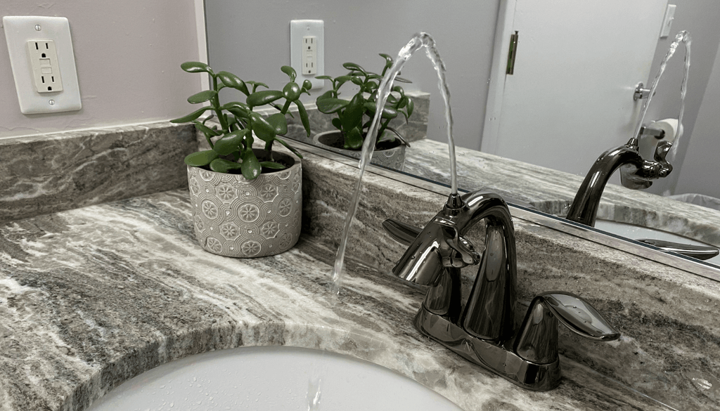 Gloss black Nasoni bathroom fountain faucet creates the perfect water fountain.