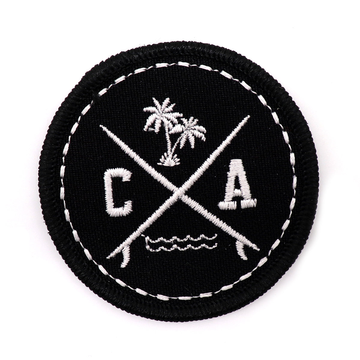 California surf board patch featuring a black circle with embroidered palm trees, surf boards, ocean beach waves, and letters CA. Great addition to sew on to your backpack, jacket, or any fabric. Exclusively sold by SDTrading Co.