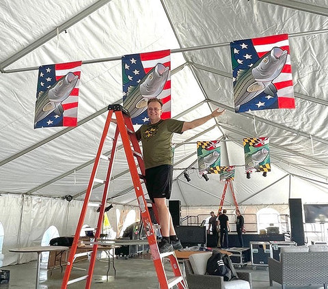 Hanging citizen pride flags at F4AC Shore Party 2022!