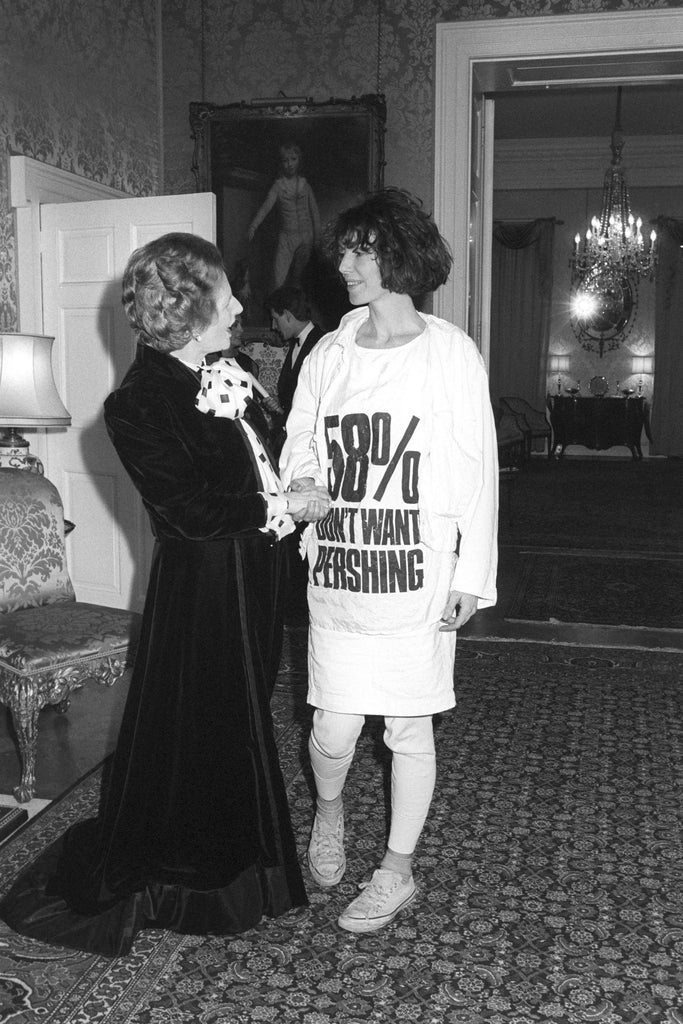 Katharine Hamnett in a slogan Tshirt saying “58% DON’T WANT PERSHING” at a reception in 1984 meeting Margaret Thatcher