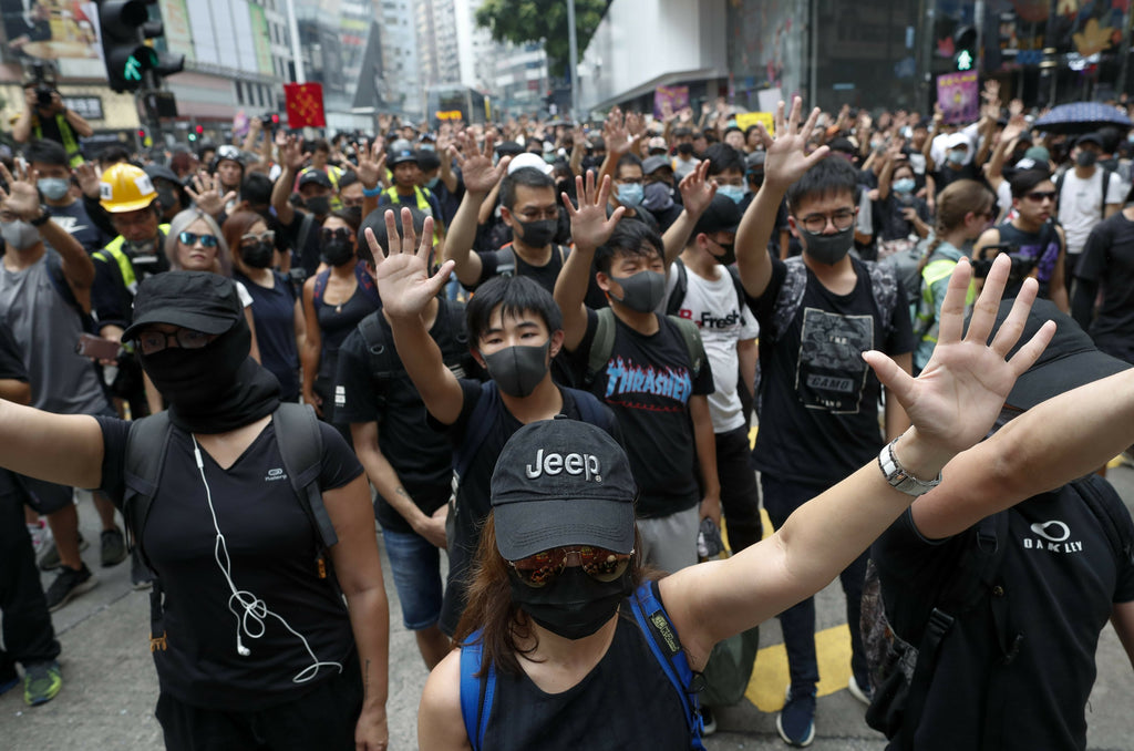 Hong Kong anti-government demonstrators in black in 2019